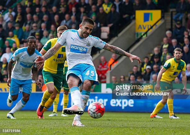 Newcastle Uniteds Serbian striker Aleksandar Mitrovic scores from the penalty spot during the English Premier League football match between Norwich...