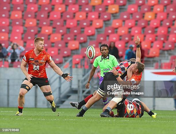 Riaan Viljoen of Sunwolves passes to Ed Quirk of Sunwolves during the 2016 Super Rugby match between Southern Kings and Sunwolves at Nelson Mandela...