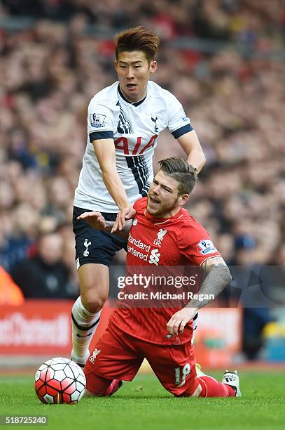 Alberto Moreno of Liverpool is challenged by Son Heung-min of Tottenham Hotspur during the Barclays Premier League match between Liverpool and...