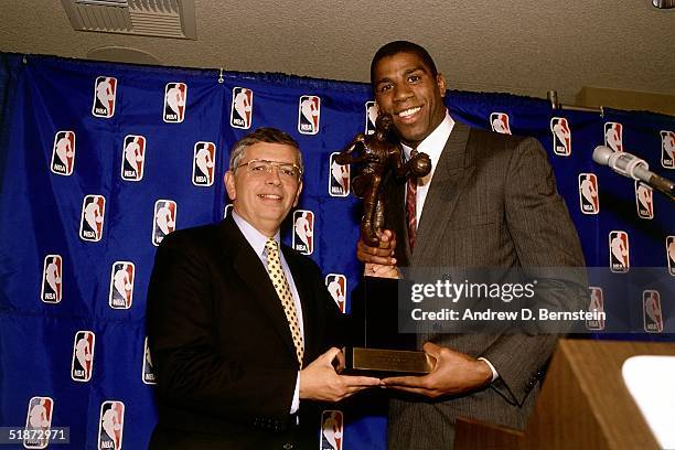 Commissioner David Stern presents Magic Johnson of the Los Angeles Lakers the MVP award circa 1989 in Los Angeles, California. NOTE TO USER: User...