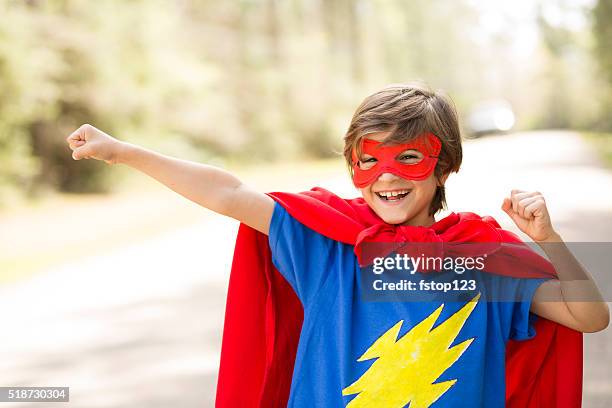 little boy playing superhero outdoors. pretend, dress up. - överkroppsbild bildbanksfoton och bilder