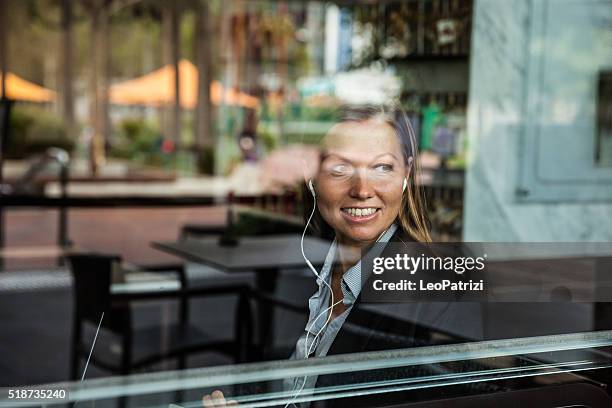 business woman having a break in a restaurant - long weekend australia stock pictures, royalty-free photos & images