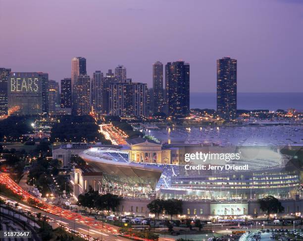 General view of the New Soldier Field Stadium with the Chicago skyline background at dusk prior to a game between the Green Bay Packers and the...