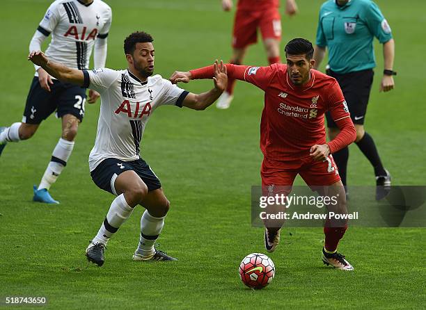 Emre Can of Liverpool tussles with Mouse Dembele of Tottenham Hotspur during the Barclays Premier League match between Liverpool and Tottenham...