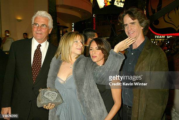 Actress/singer Barbra Streisand and husband actor James Brolin pose with director Jay Roach and his wife musician Susanna Hoffs at the premiere of...