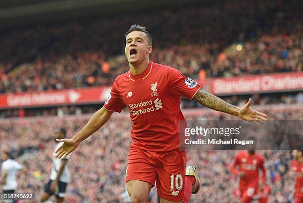 Philippe Coutinho of Liverpool celebrates scoring his team's first goal during the Barclays Premier League match between Liverpool and Tottenham...