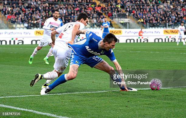 Francesco Acerbi of US Sassuolo is challenged vby Kevin Lasagna of Carpi FC during the Serie A match between Carpi FC and US Sassuolo Calcio at...