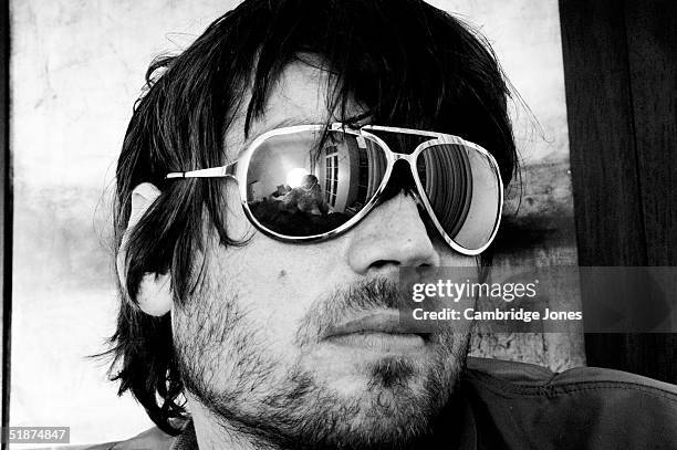 Musician Alex James poses at a photoshoot in London on the 14th of July 2004.