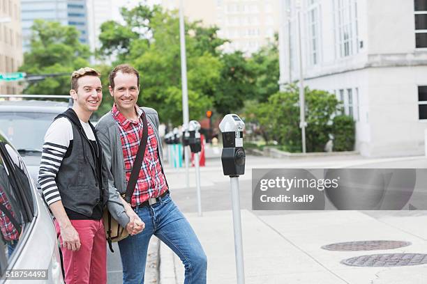 gay men in city - happiness meter stock pictures, royalty-free photos & images