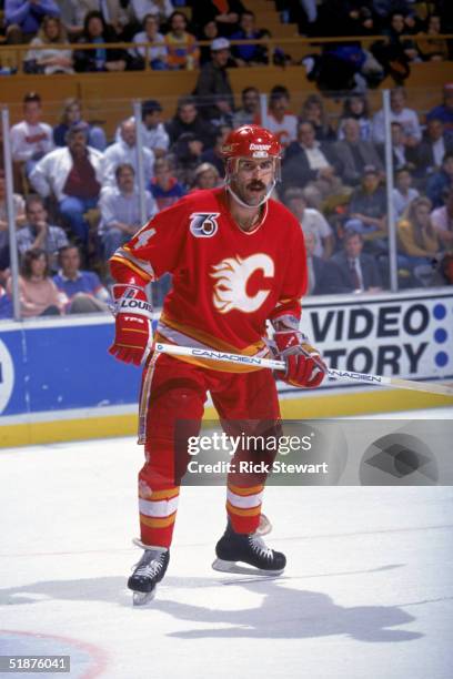 Jamie Macoun of the Calgary Flames skates during a game against the Buffalo Sabres at Buffalo Memorial Auditorium on December 17, 1991 in Buffalo,...
