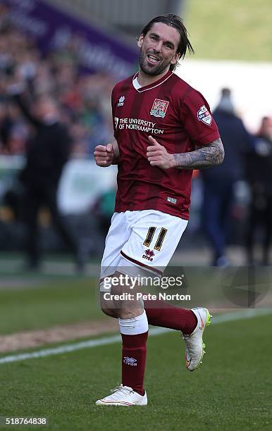 Ricky Holmes of Northampton Town celebrates after scoring his and his sides first goal during the Sky Bet League Two match between Northampton Town...