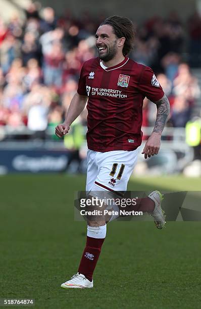 Ricky Holmes of Northampton Town celebrates after scoring his and his sides first goal during the Sky Bet League Two match between Northampton Town...