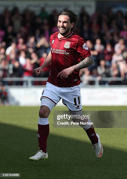 Ricky Holmes of Northampton Town celebrates after scoring his and his sides first goal during the Sky Bet League Two match between Northampton Town...