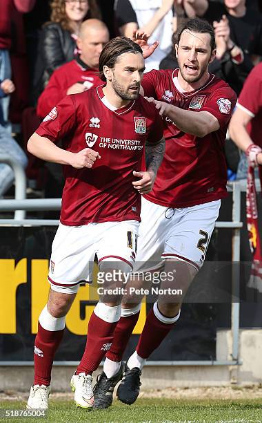Ricky Holmes of Northampton Town celebrates with team mate John-Joe O'Toole after scoring his and his sides second goal during the Sky Bet League Two...