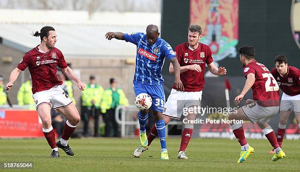 Izale McLeod of Notts County attempts to control the ball watched by Zander Diamond, Danny Rose and John-Joe O'Toole of Northampton Town during the...