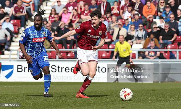 Brendan Moloney of Northampton Town moves forward with the ball away from Stanley Aborah of Notts County during the Sky Bet League Two match between...