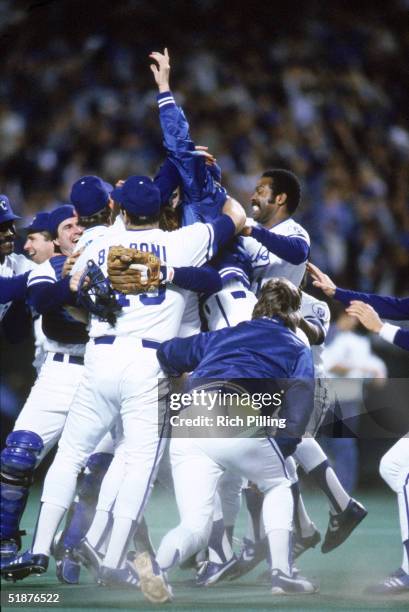 The Kansas City Royals celebrate winning their championship after defeating the St. Louis Cardinals in Game Seven of the 1985 World Series at...