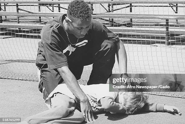 Athlete and volunteer at Johns Hopkins University during the Special Olympics, Maryland, 1995.