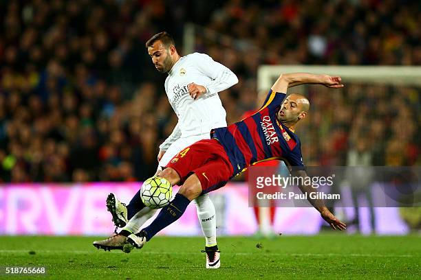 Javier Mascherano of FC Barcelona battles for the ball with Jese of Real Madrid CF during the La Liga match between FC Barcelona and Real Madrid CF...