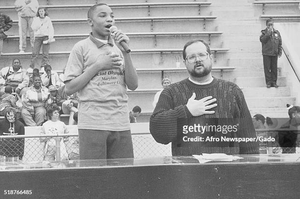 Child singing during the Special Olympics, Maryland, 1995.
