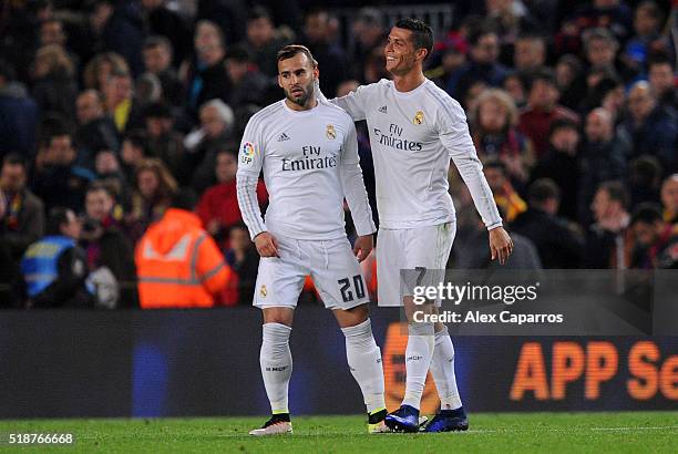 Cristiano Ronaldo of Real Madrid CF celebrates with team-mate Jese after the La Liga match between FC Barcelona and Real Madrid CF at Camp Nou on...