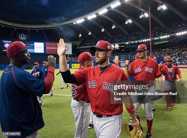 Travis Shaw of the Boston Red Sox celebrates a victory over the Toronto Blue Jays on April 2, 2016 at Olympic Stadium in Montreal, Quebec.