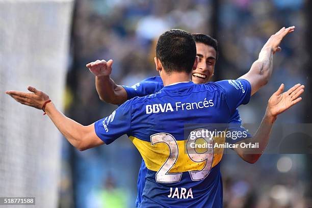 Federico Carrizo of Boca Juniors celebrates with teammate Leonardo Jara after scoring the second goal of his team during a match between Boca Juniors...