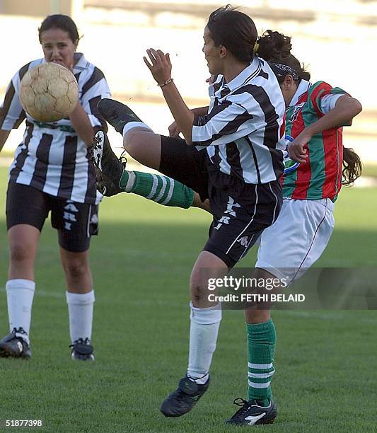 Sfax's ASF, Fatma Methlouthi vies with Khaoula Douri of Stade Tunisien during the first day of a female football league 18 December 2004 at Zouiten's...