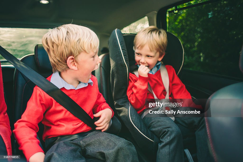 Two school children in the car