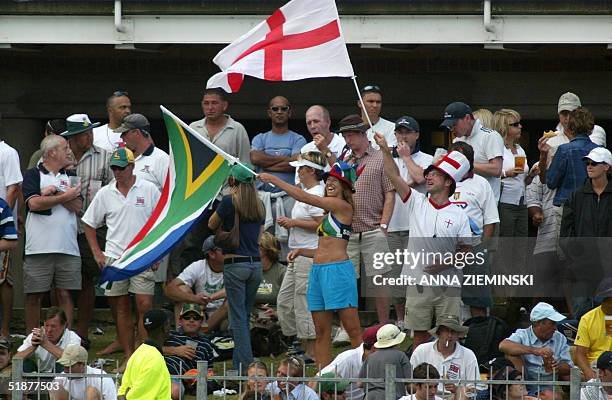 South African and England's Cross of St George flags are flown by fans at St George's Park cricket stadium in Port Elizabeth 18 December 2004, on the...