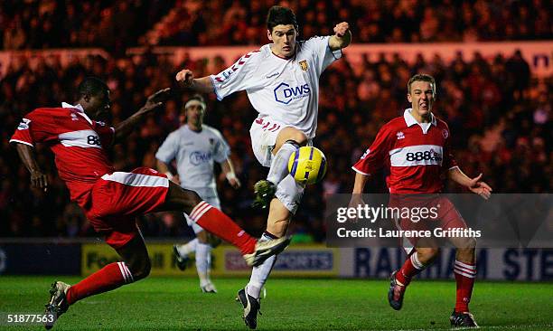 Gareth Barry of Villa goes close with a chance under pressure from George Boateng and Tony McMahon of Middlesbrough during the FA Barclays...