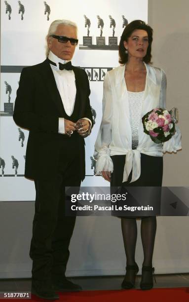 Princess Caroline of Hanover arrives with Karl Lagerfeld to attend the Nijinsky Awards Ceremony at The Monaco Dance Forum on December 18, 2004 in...