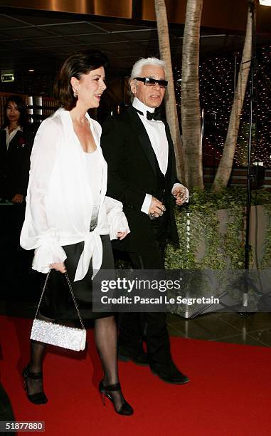 Princess Caroline of Hanover arrives with Karl Lagerfeld to attend the Nijinsky Awards Ceremony at The Monaco Dance Forum on December 18, 2004 in...