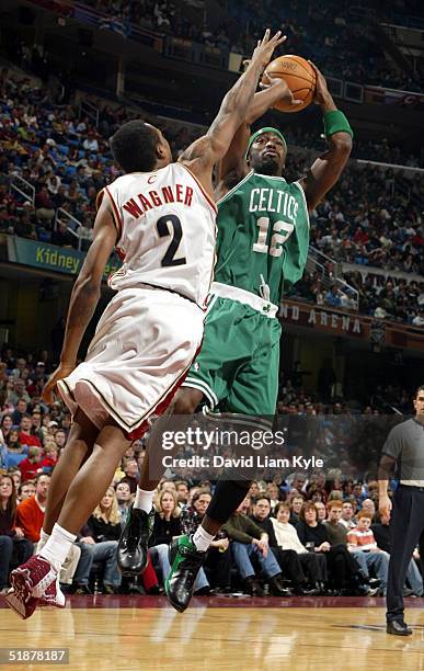 Ricky Davis of the Boston Celtics shoots over Dajuan Wagner of the Cleveland Cavaliers on December 18, 2004 at Gund Arena in Cleveland, Ohio. NOTE TO...