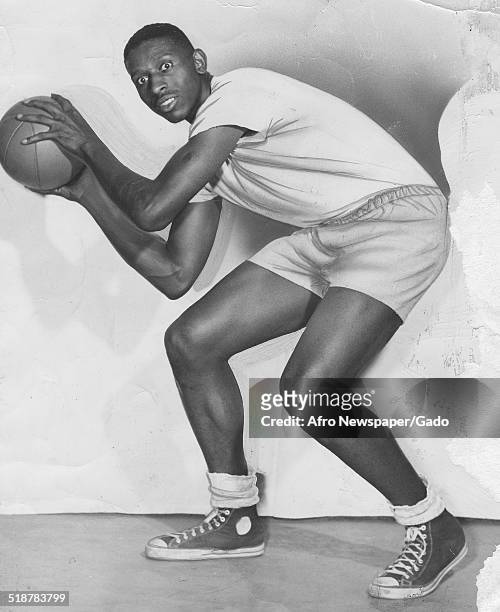Basketball player Earl Lloyd dribbling a basketball, Virginia, 1966.