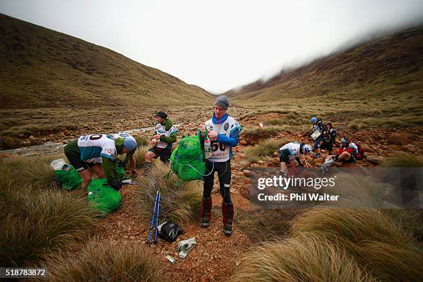 Team Motueka stop at a control point in the Red Hills on day two of the GODZone multi day adventure race on April 3, 2016 in Nelson, New Zealand.