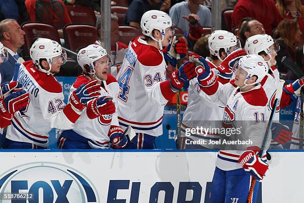 Brendan Gallagher of the Montreal Canadiens is congratulated by teammates after scoring a first period goal against the Florida Panthers at the BB&T...