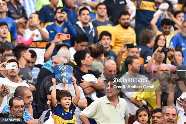 Kid fan of Boca Juniors cheers for his team during a match between Boca Juniors and Atletico Rafaela as part of 9th round of Torneo Transicion 2016...