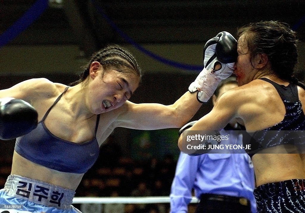 South Korean boxer Kim Ju-Hee (L) lands