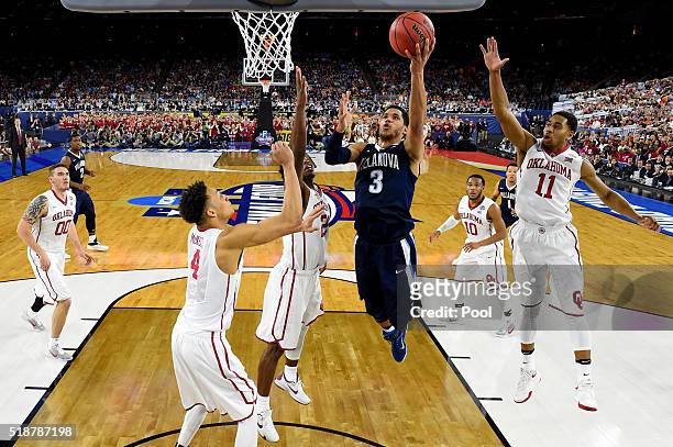 Josh Hart of the Villanova Wildcats drives to the basket against Jamuni McNeace of the Oklahoma Sooners, Buddy Hield, and Isaiah Cousins in the...