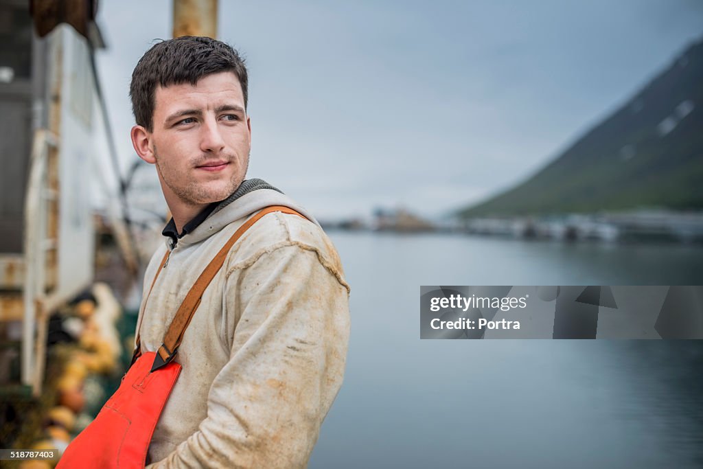 Thoughtful fisherman on boat