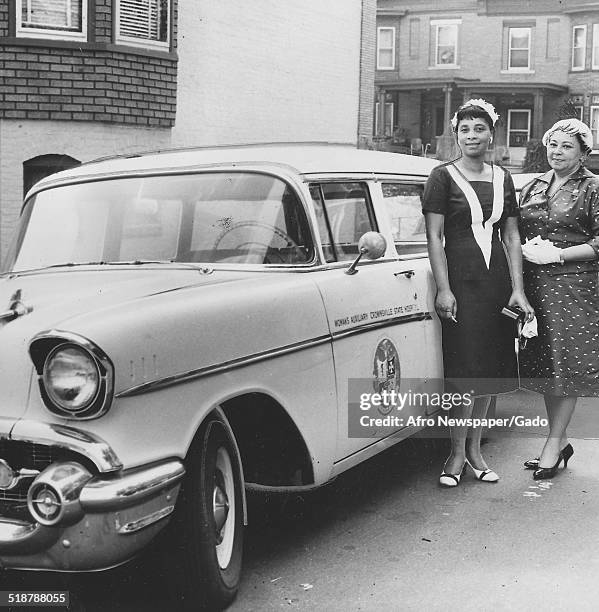 Albert LaForest and Bradshaw Higgins leaning on a car at Crownsville State Hospital psychiatric hospital , Crownsville, Maryland, October 10, 1959.