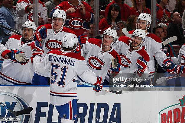 David Desharnais of the Montreal Canadiens is congratulated by teammates after scoring a second period goal against the Florida Panthers at the BB&T...