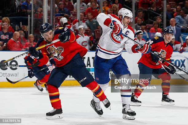 Max Pacioretty of the Montreal Canadiens and Rocco Grimaldi of the Florida Panthers come together at mid ice during second period action at the BB&T...