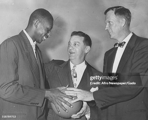 Basketball player Earl Lloyd , Jim Magner and Horace Kinley, October 20, 1950.