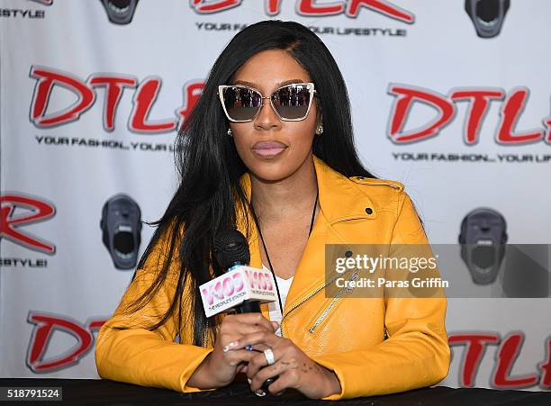 Recording artist K. Michelle attends her "More Issues Than Vogue" cd signing at DTLR on April 2, 2016 in Atlanta, Georgia.