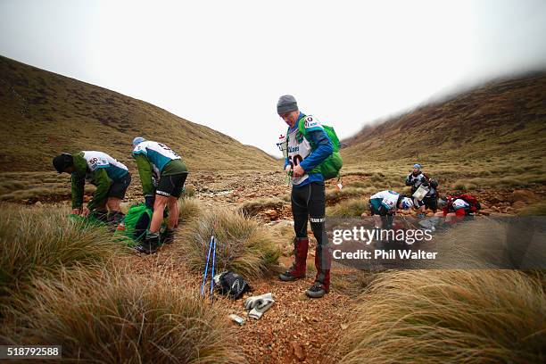 Team Motueka stop at a control point in the Red Hills on day two of the GODZone multi day adventure race on April 3, 2016 in Nelson, New Zealand.