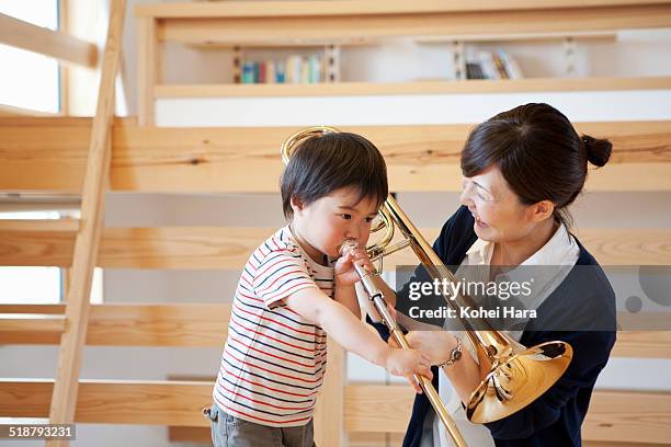 a musical family at home - japan mom and son stock pictures, royalty-free photos & images