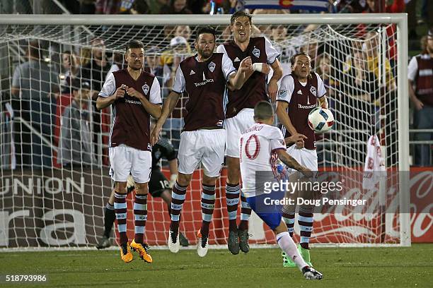 Luis Solignac, Bobby Burling, Axel Sjoberg and Marc Burch of Colorado Rapids defend against a free kick by Sebastian Giovinco of Toronto FC at Dick's...