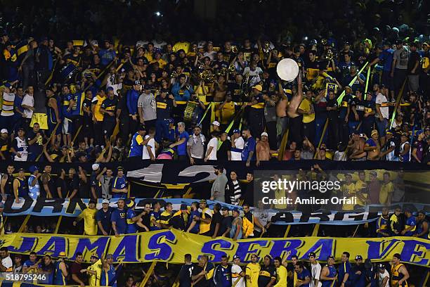 Fans of Boca Juniors cheer for their team during a match between Boca Juniors and Atletico Rafaela as part of 9th round of Torneo Transicion 2016 at...